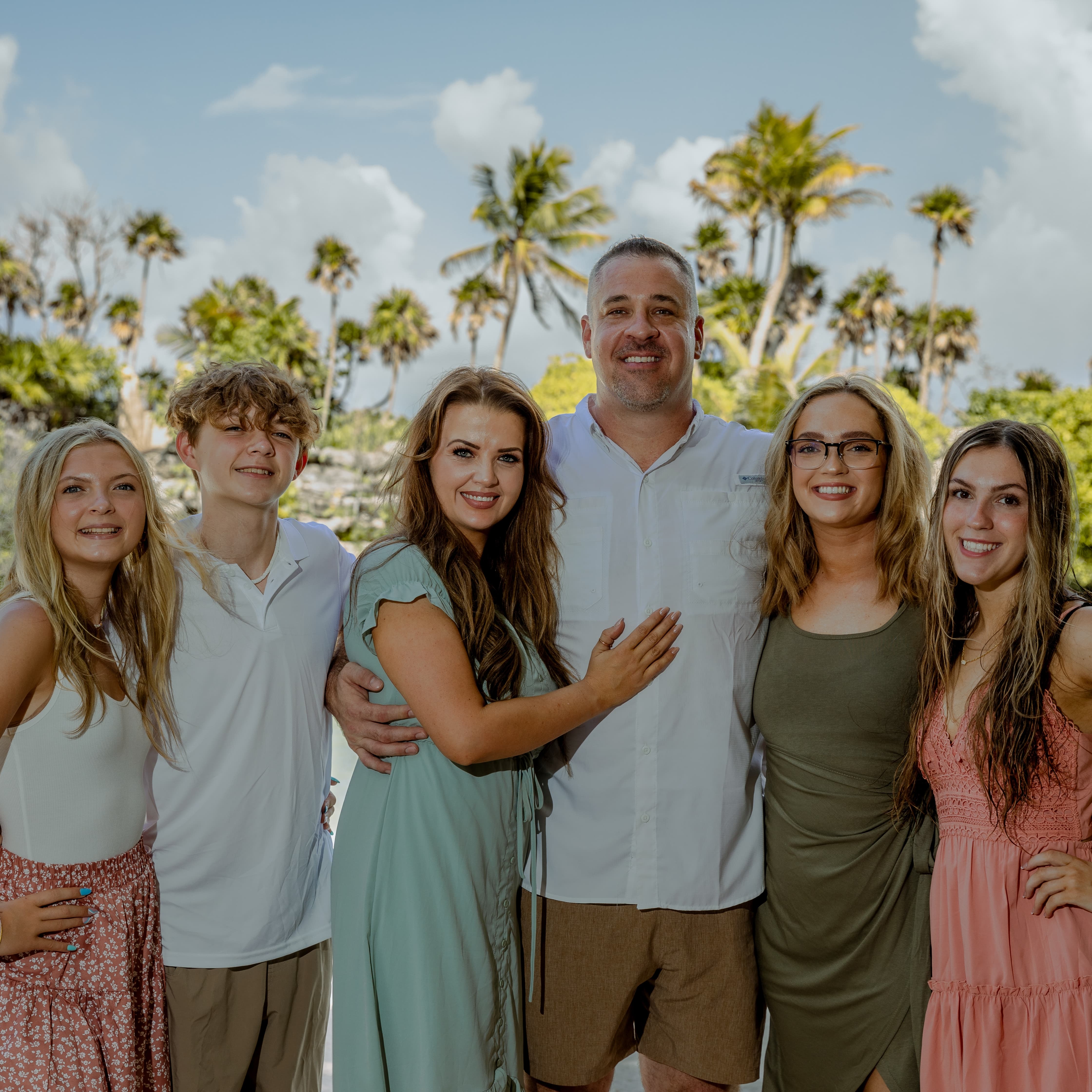 Chelsea and Jarrod, the owners of Advanced Septic, with their family
