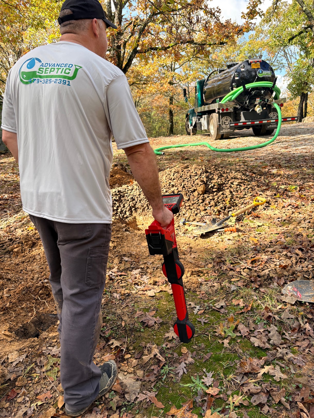 Septic tank access area being evaluated at a work site